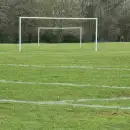 An empty football pitch with goals